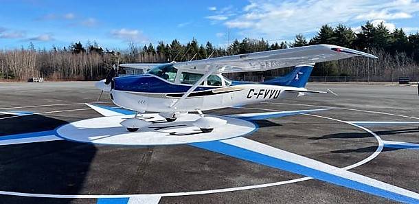 <p>FACEBOOK PHOTO/SOUTH SHORE FLYING CLUB</p><p>A visiting Cessna 182 on the bullseye of the Compass Rose, with the call letters CYAU, on the apron at the South Shore Regional Airport.</p>