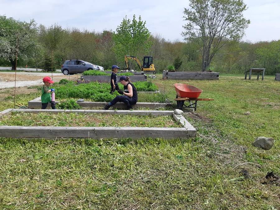 <p>FACEBOOK PHOTO</p><p>Emily Ferguson and her sons Layton and Carson were part of a volunteer crew that rejuvenated the Plant to Plate Community Gardens in Liverpool May 22.</p>