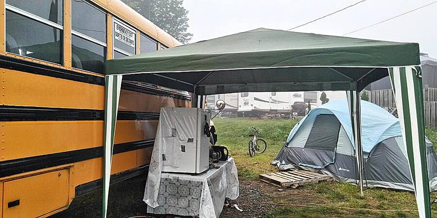 <p>DAYLE CROUSE, PHOTO</p><p>Dayle Crouse and her family have been living in a tent at a campground outside of Lunenburg since May after being unable to find affordable housing in the area. She recently purchased a school bus which she is renovating into a tiny home for her and her children.</p>