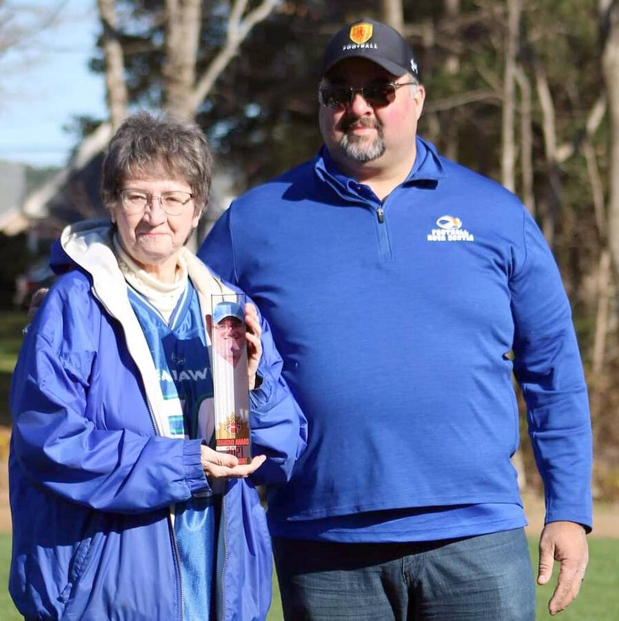 <p>SUBMITTED PHOTO</p><p>Louie Velocci of Football Nova Scotia recently presented Gary Linthorne&#8217;s widow, Lynne Ware, with Football Canada&#8217;s diamond award. Linthorne, who died in the spring, was named the inaugural recipient of the national honour, which goes to an individual who has demonstrated a significant contribution to the development of the amateur game at any level.</p>