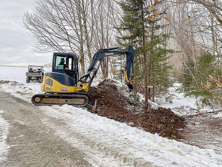 <p>SUBMITTED PHOTO</p><p>Machine owner and operator Kendall Ernst helped clear the path.</p>