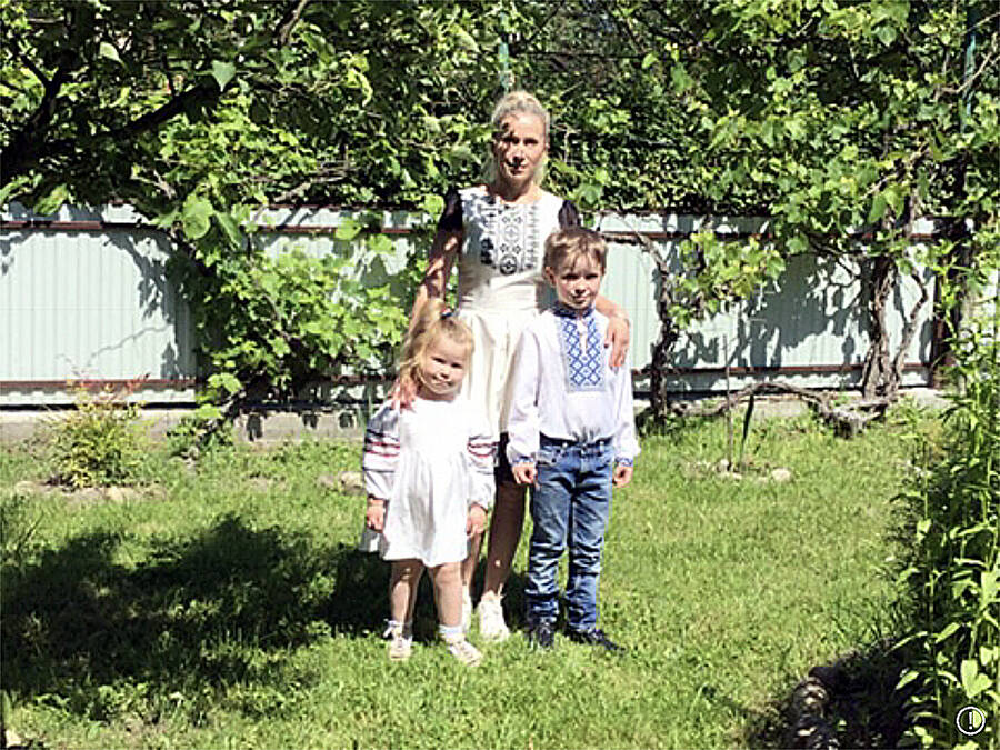 <p>SUBMITTED PHOTO</p><p>Nataliia Belcher and her two children previously in Ukraine in their traditional clothing. As she described it: &#8220;a great memory of peaceful Ukraine.&#8221;</p>