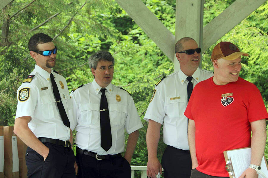 <p>SUBMITTED PHOTO</p><p>Senior officers with the Chester volunteer fire department, from left; Jared MacDonald, Greg Conron and Cody Stevens share a light moment June 11 with Andrew Chandler, right, executive director of the Chester Playhouse Theatre.</p>
