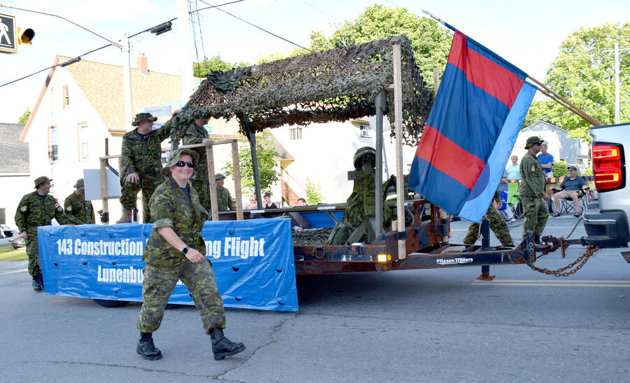 <p>Members of the 143 Construction Engineering Flight march along the parade route.</p>