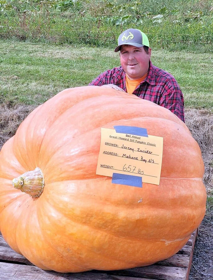 <p>SUBMITTED PHOTO</p><p>Jeremy Zwicker and his award-winning pumpkin.</p>