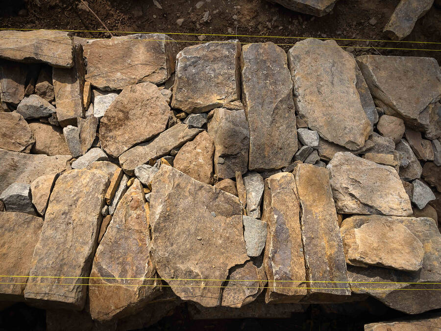 <p>PHOTO BY PAUL NEWTON</p><p>A photo from the top of the rock wall, showing how the rocks are positioned to keep the wall solid.</p>