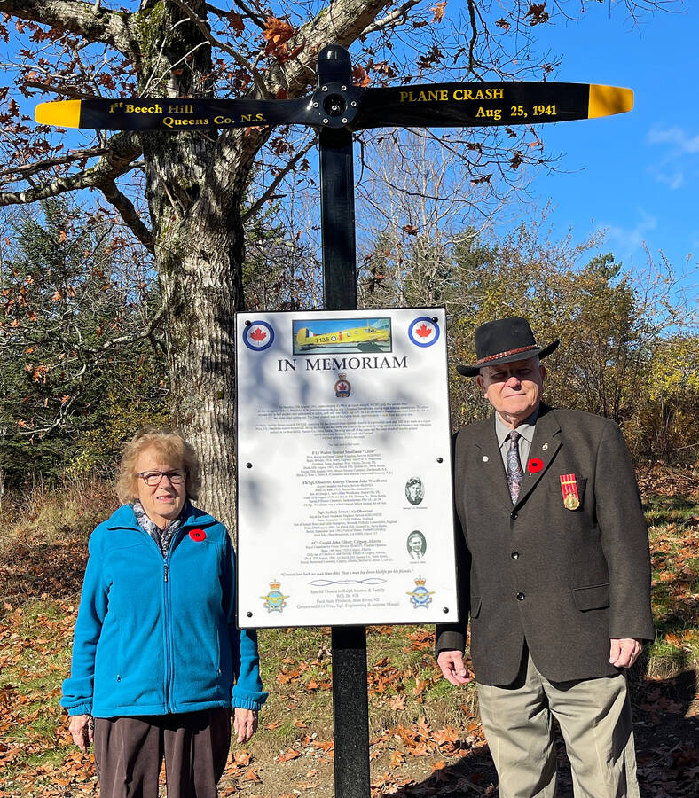 <p>CONTRIBUTED PHOTO</p><p>Shirley and Ralph Morton stand my a monument that Ralph built on his property to honour four airmen that died in a crash on First Beech Hill Road. This photo was taken Nov. 11, 2021. The monument was officially dedicated by the Royal Canadian Legion Mersey #38 branch this past Nov. 25, 81 years after the crash. Ralph, unfortunately died this past June.</p>