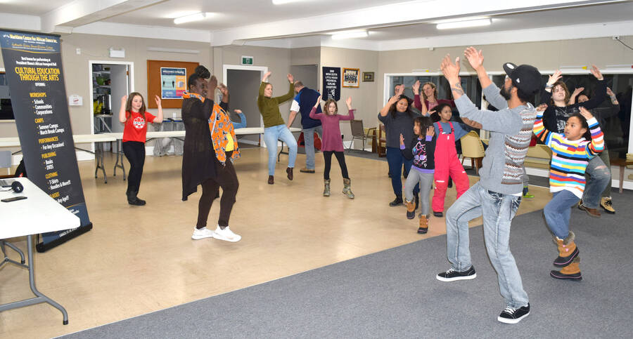 <p>Kevin McBain PHOTO</p><p>Mufaro Chakabuda leads the group at the curling club in some African dancing during a workshop session at the Liverpool Curling Club March 7.</p>