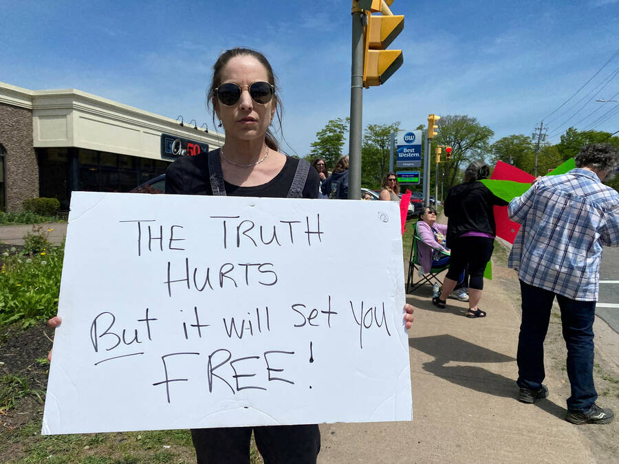 <p>FILE PHOTO</p><p>Charlene Bagley holds up a sign while protesting outside the Mass Casualty Commission proceedings at the Best Western Glengarry in Truro last year. The daughter of mass shooting victim Tom Bagley, as well as other victims&#8217; family members, were boycotting the proceedings.</p>