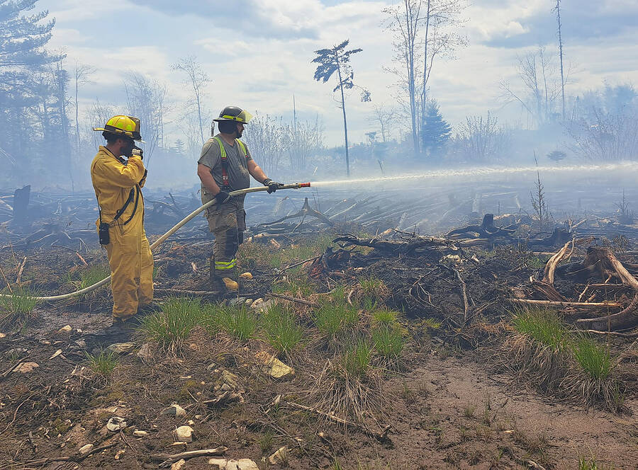 <p>CONTRIBUTED PHOTOS</p><p>Tri-district volunteer firefighters battle a woods fire in Chelsea on May 6.</p>