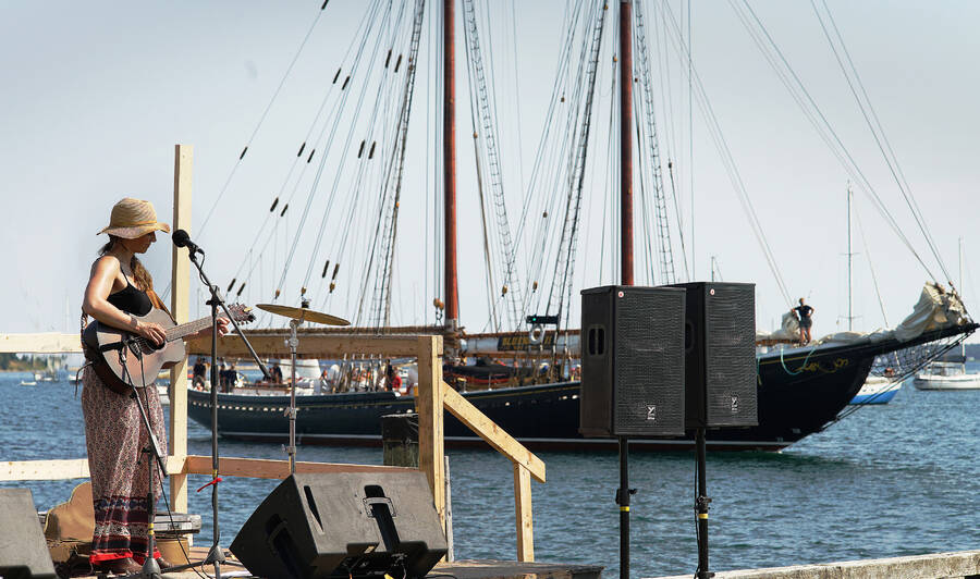<p>FILE PHOTO</p><p>Performer Terra Spencer from Windsor is photo-bombed by the Bluenose II on the wharf stage at the 2022 Lunenburg Folk Harbour Festival. She will be performing on the main stage at this year&#8217;s event, on Aug. 10.</p>