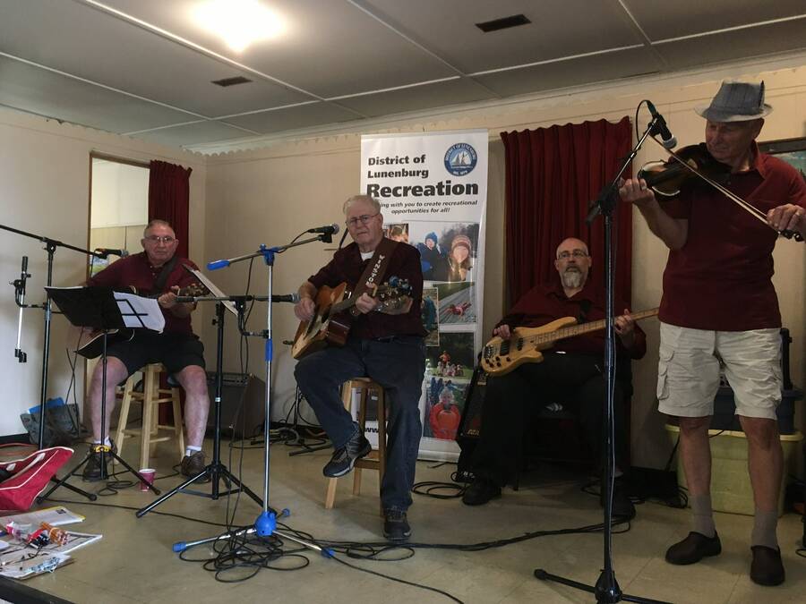<p>CONTRIBUTED PHOTO</p><p>Winston Shatford (second from left) playing some music with some friends during a Municipality of the District of Lunenburg corn boil event at the Parkdale-Maplewood hall. In June, he was recognized by MODL for 60 years of sharing his talents throughout the municipality at many events from corn boils to entertaining crowds at nursing homes.</p>