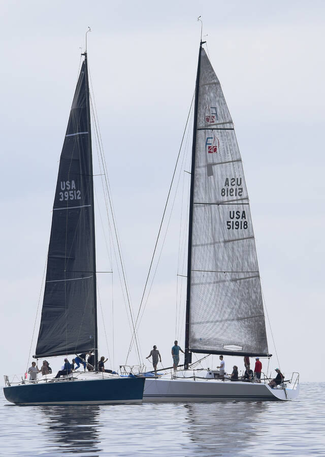 <p>Kevin McBain PHOTO</p><p>Skipper Graham Roy of Timberlea and his crew and Stu McCrea&#8217;s boat from Halifax, both in the Distance Racing division, have a chat while waiting for the start of their race Aug. 16, opening day of this year&#8217;s Chester Race Week. Races were delayed because of a lack of wind.</p>
