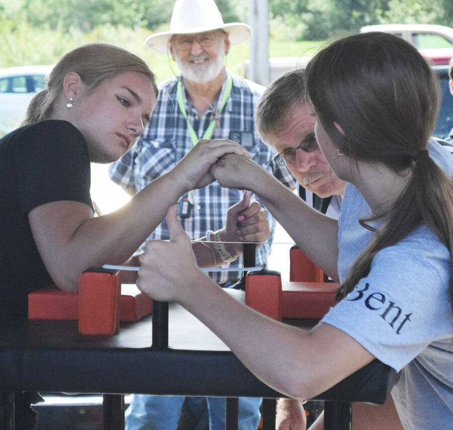 <p>Autumn Elliott (left), takes on Madison Bent in the girls&#8217; armwrestling finals.</p>