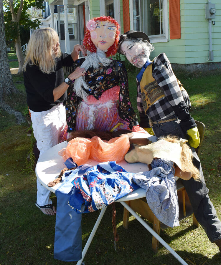 <p>FILE PHOTO</p><p>Eileen Gogol was putting on some finishing touches on her scarecrows for last year&#8217;s Mahone Bay Scarecrow Festival and Antique Fair.</p>