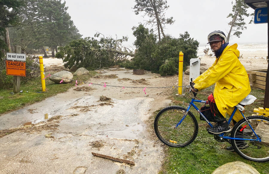 <p>Kevin McBain PHOTO</p><p>What hurricane? Ryan Weir decided to go for a bike ride to get some videos Sept. 16 despite the winds, rain and hazards along the way. This was the scene at Rissers beach campground which was flooded with water and several trees were knocked down.</p>