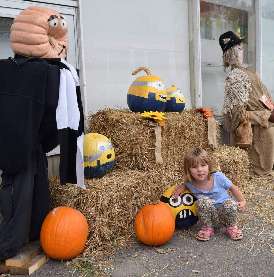 <p>Young Willow Pierce of Halifax gets her photo taken with a minion.</p>